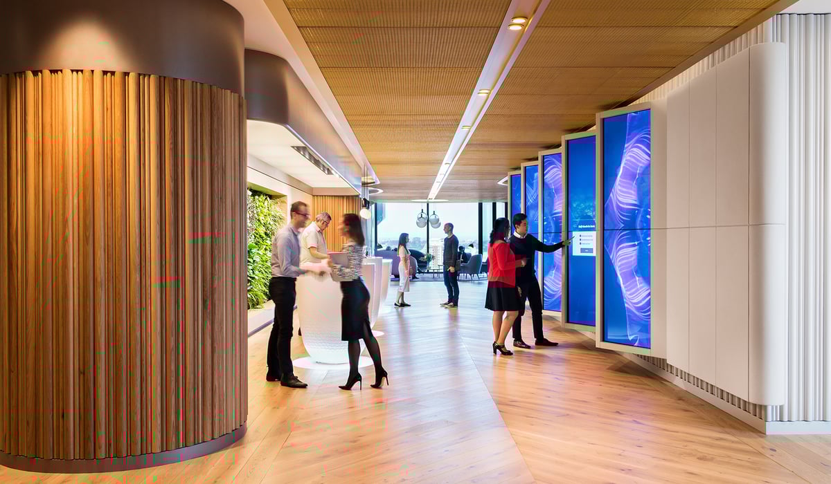 colleagues connecting in technology-enabled office
