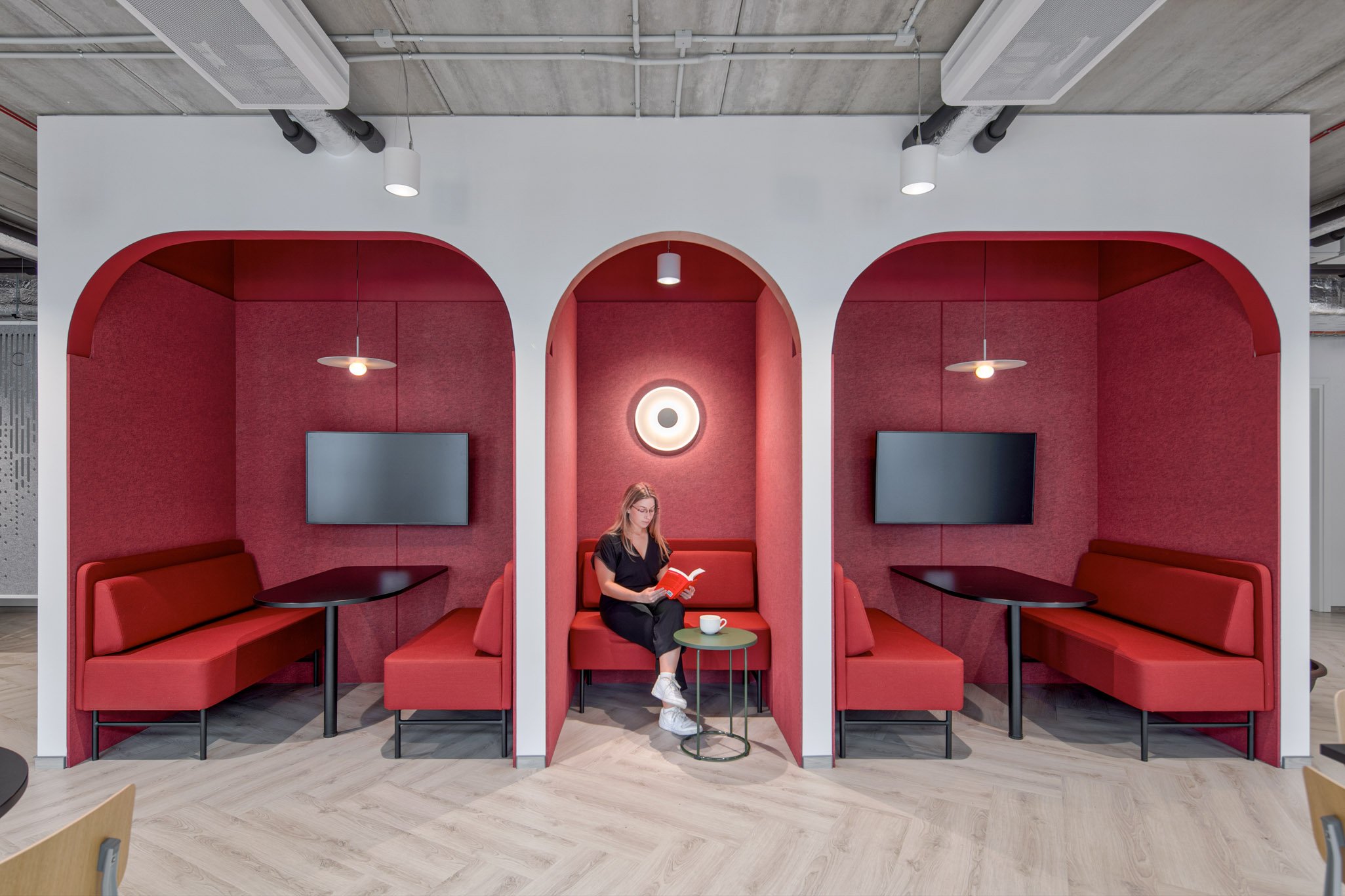 Office fit out of woman in breakout nook. 