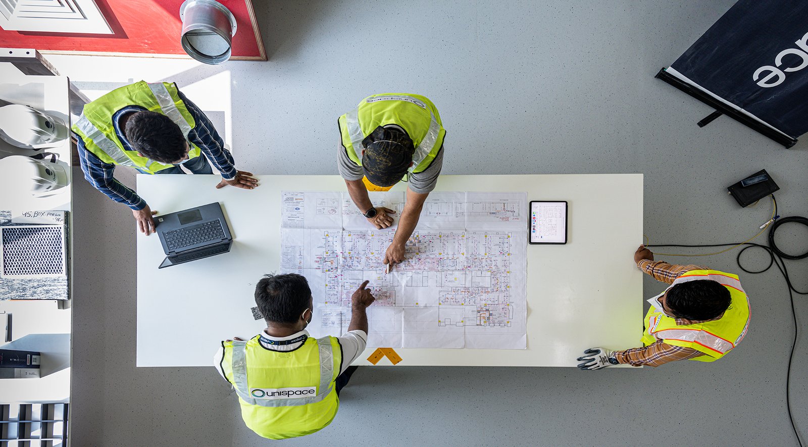 Construction team reviewing building plan