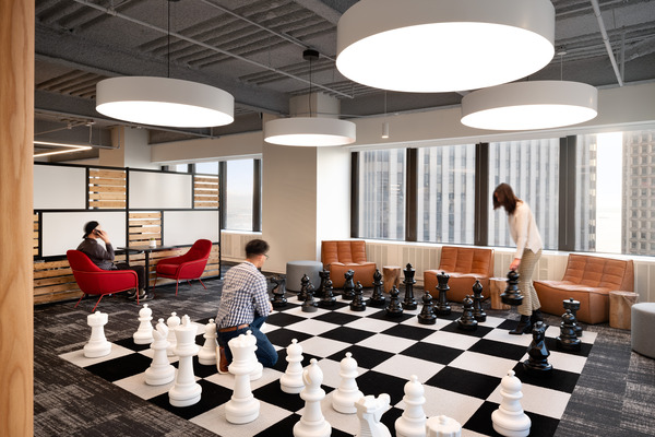 Office space, people playing chess 