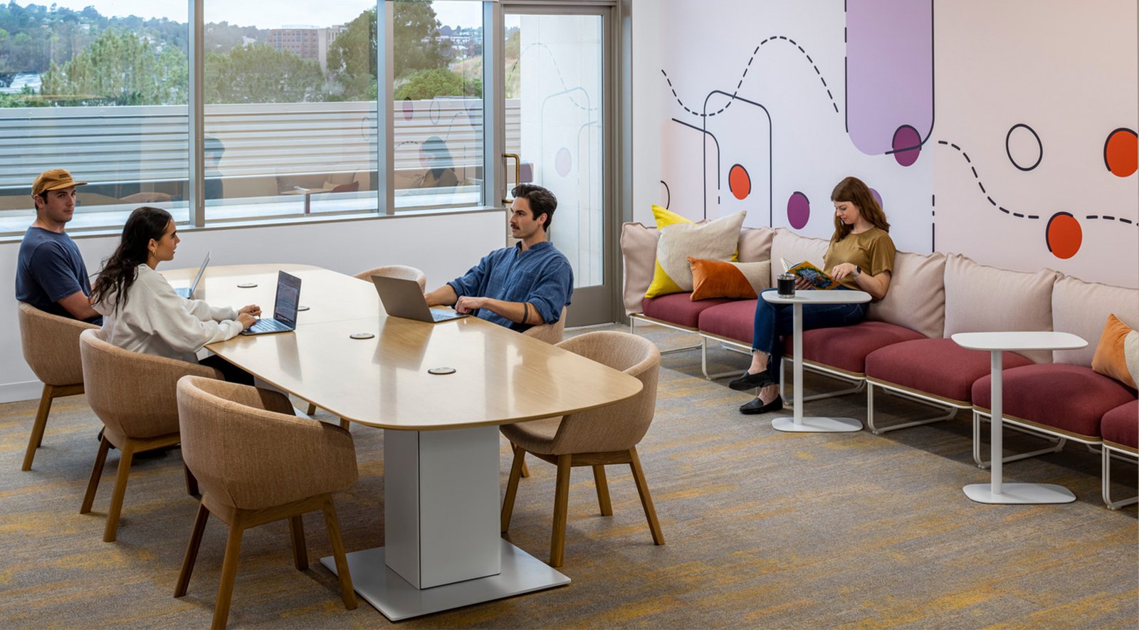 Employees sitting in an office library