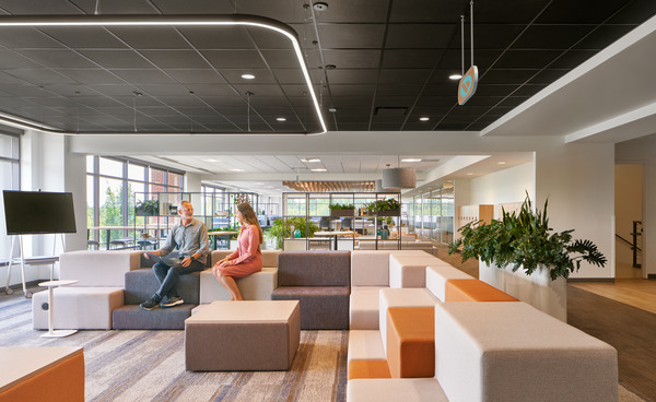 employees sitting in a town hall and talking