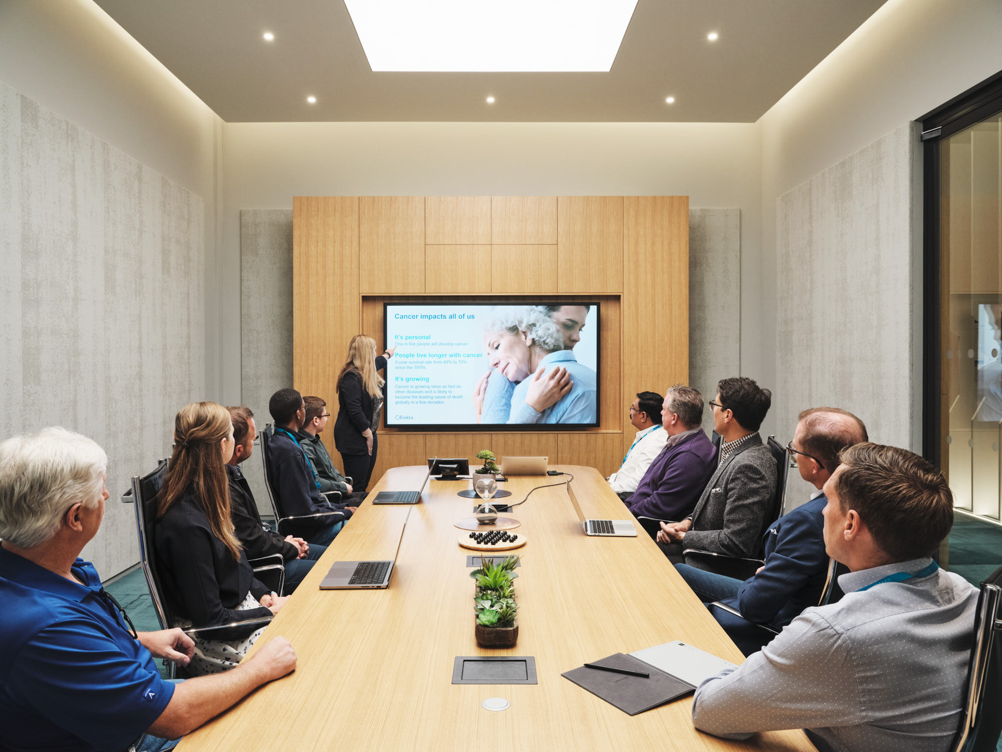 employees watching presentation in conference room