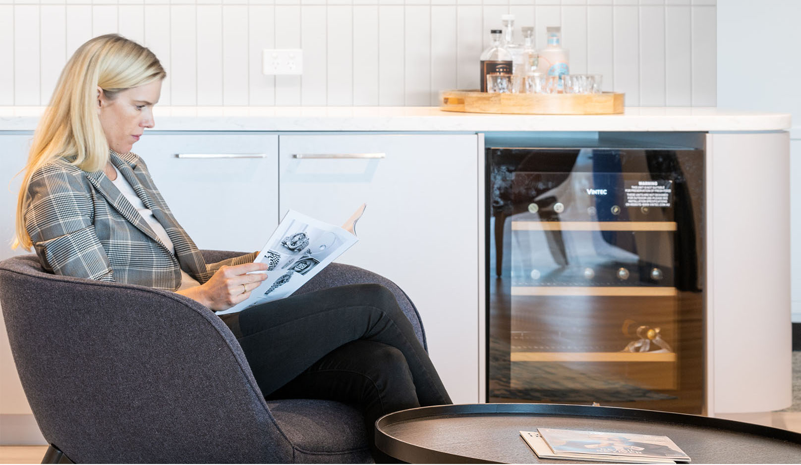 FB Rice woman reading in kitchen area