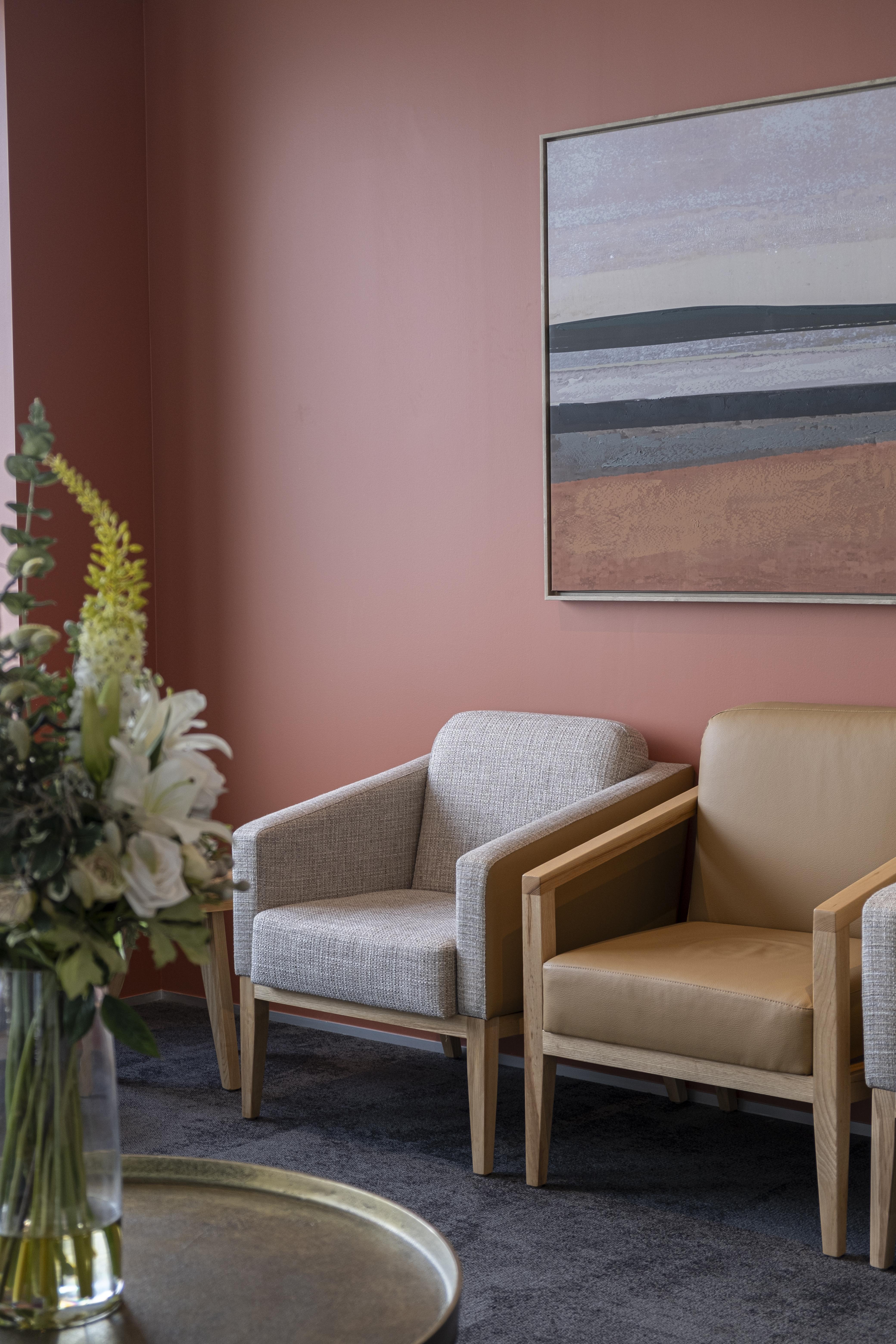 Patient waiting area with soft tones of peach and artwork