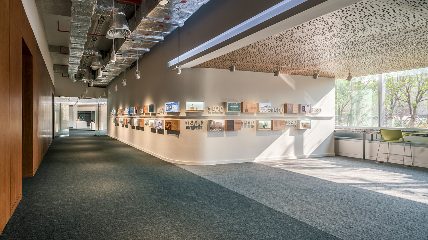 History wall that combines physical and digital elements showing the company's history