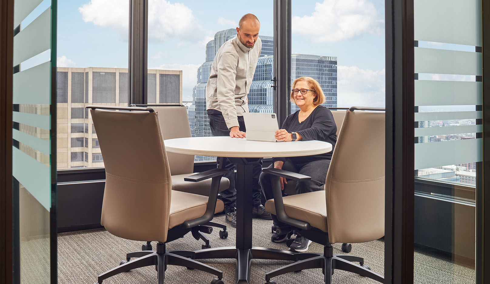 Kennedys people in conference room with view