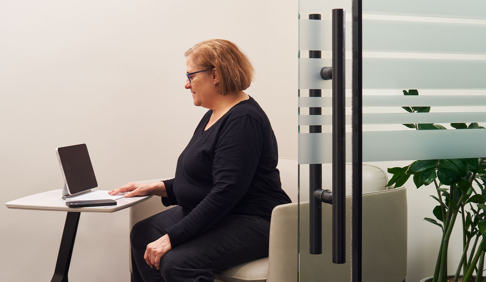 Kennedys woman working in private office room