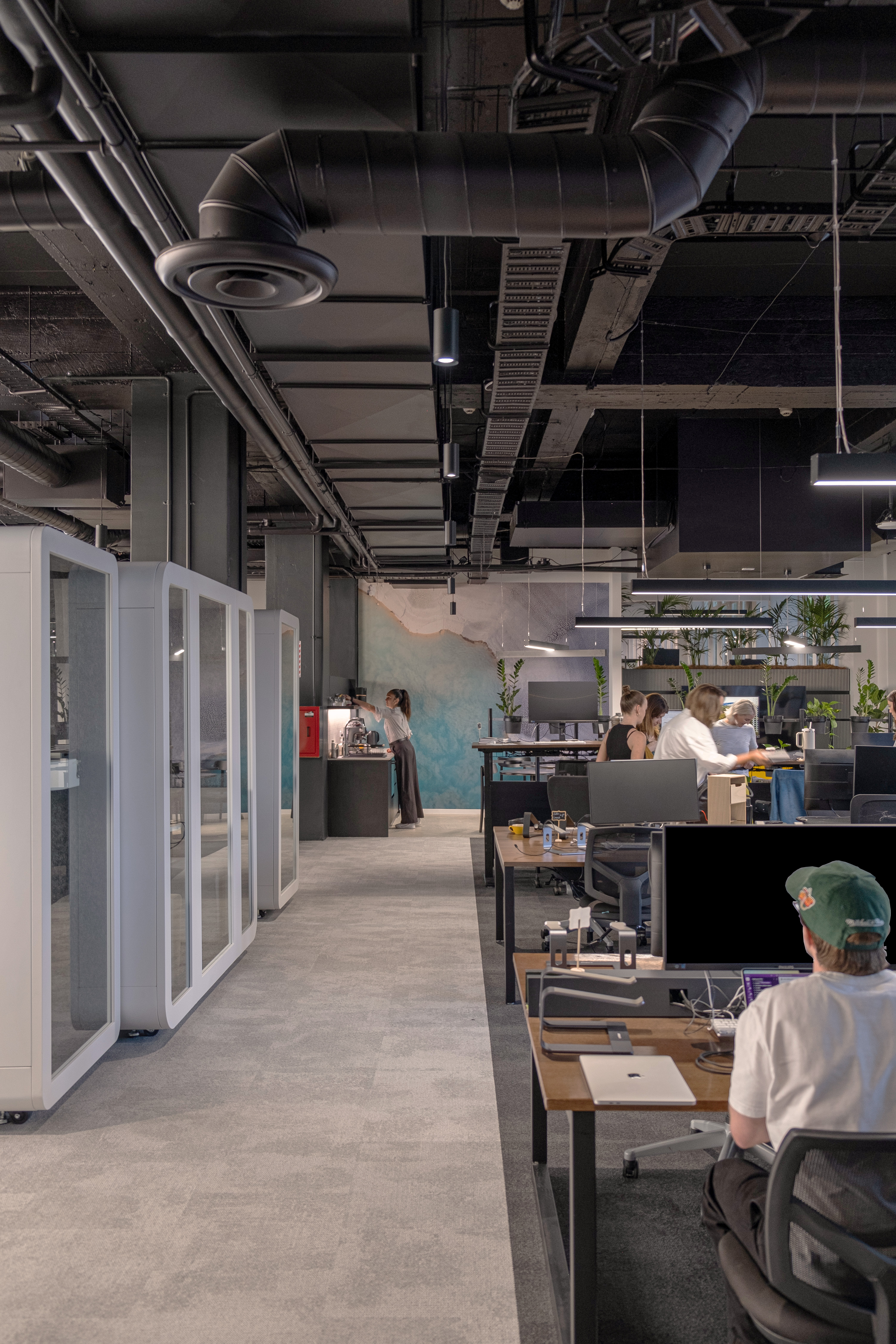 Open work stations with phone booths and teapoint