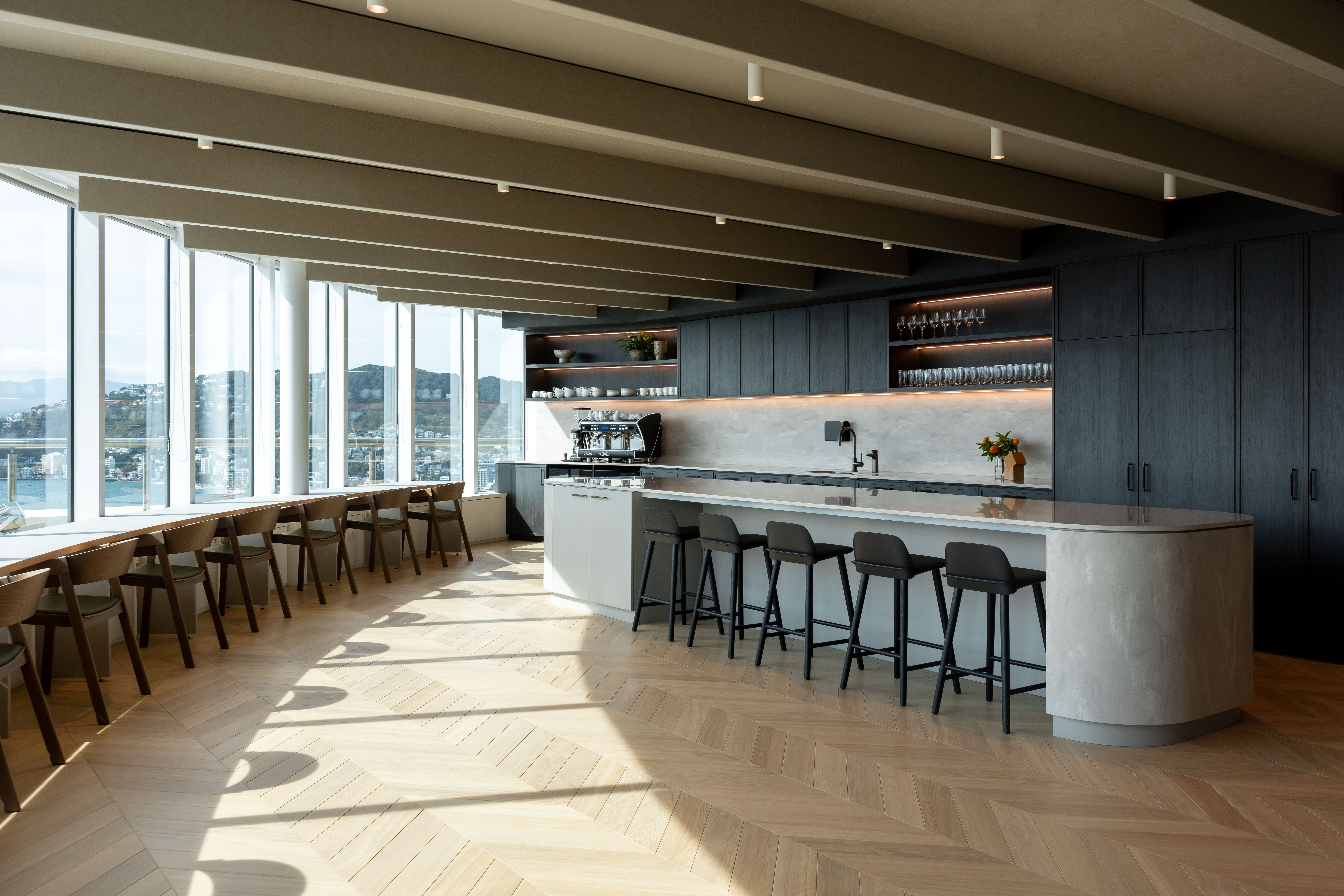 Kitchen and breakout space at Russell McVeagh's Wellington office with views that wrap around Wellington harbour