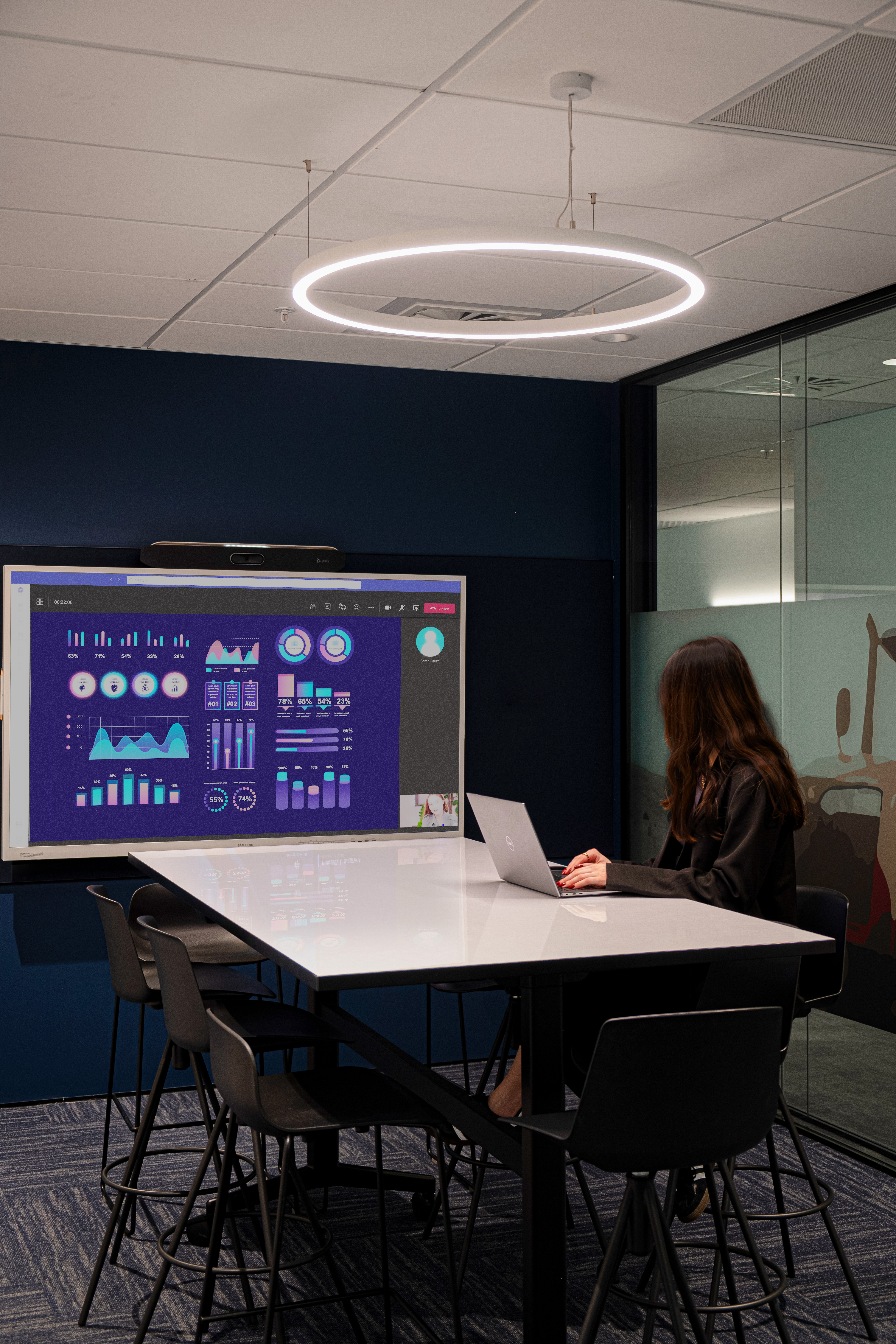 meeting room with screen, table and seats