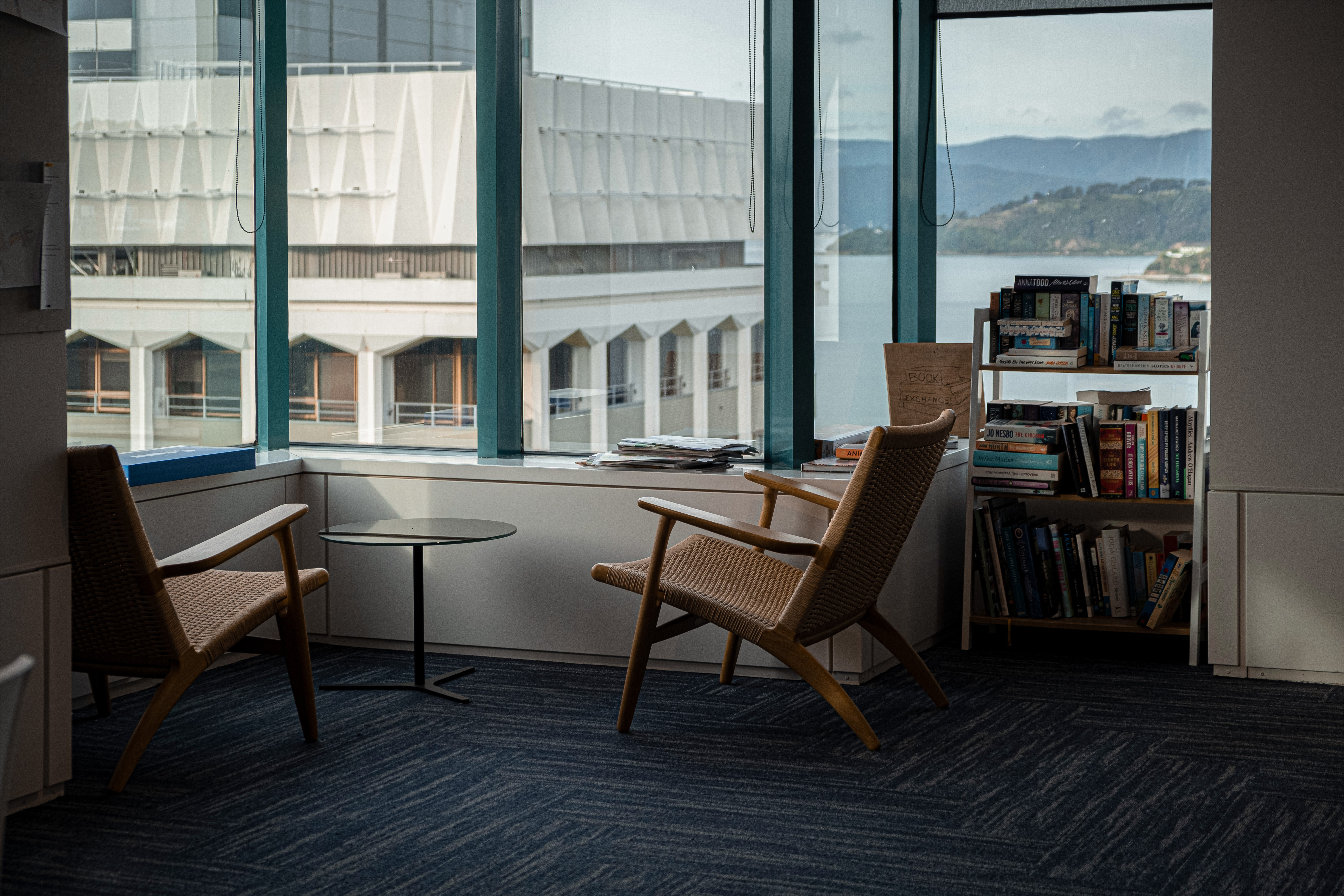 seats in corner of office looking out the windows towards the view