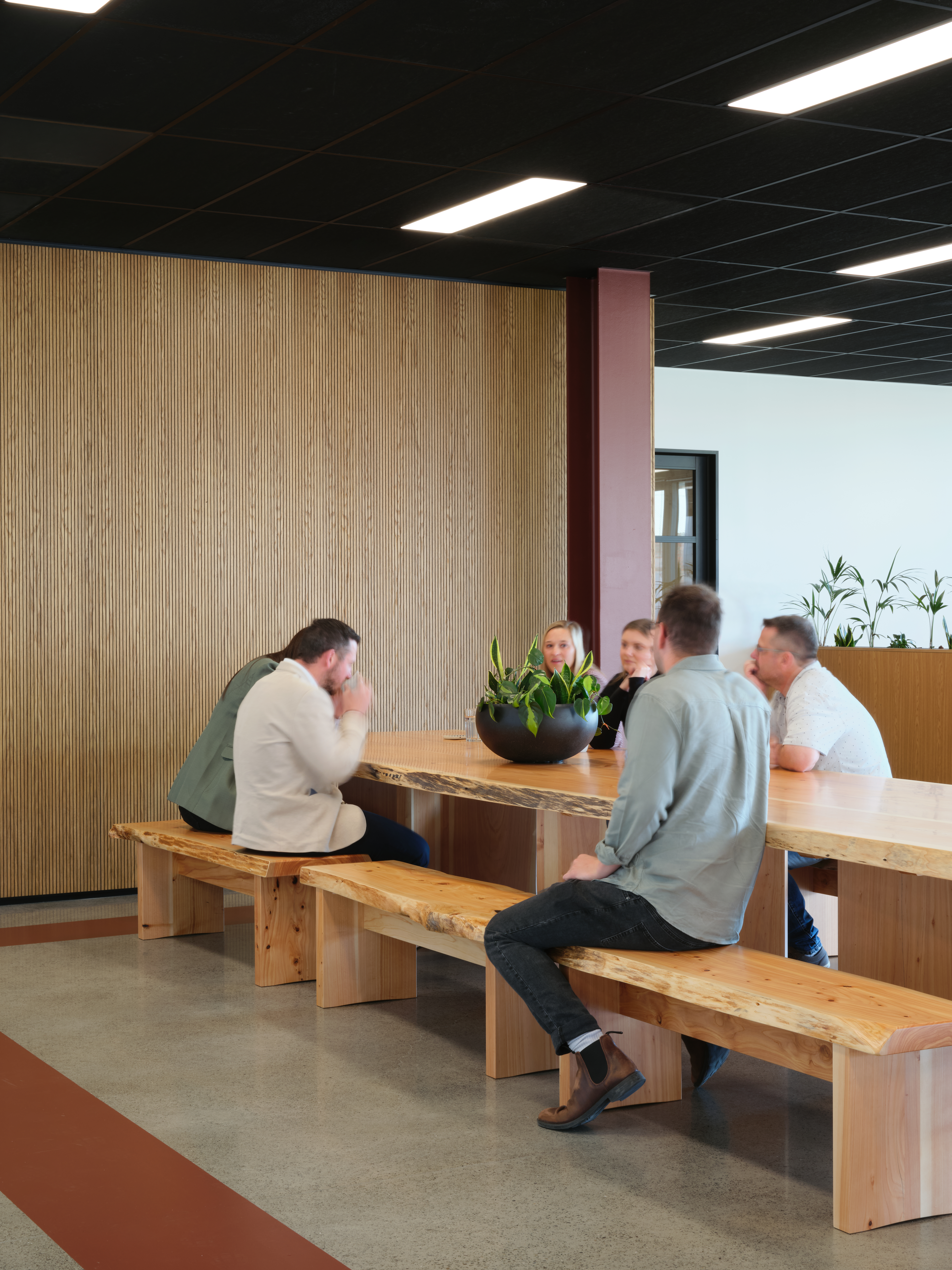Employees sat around social space chatting