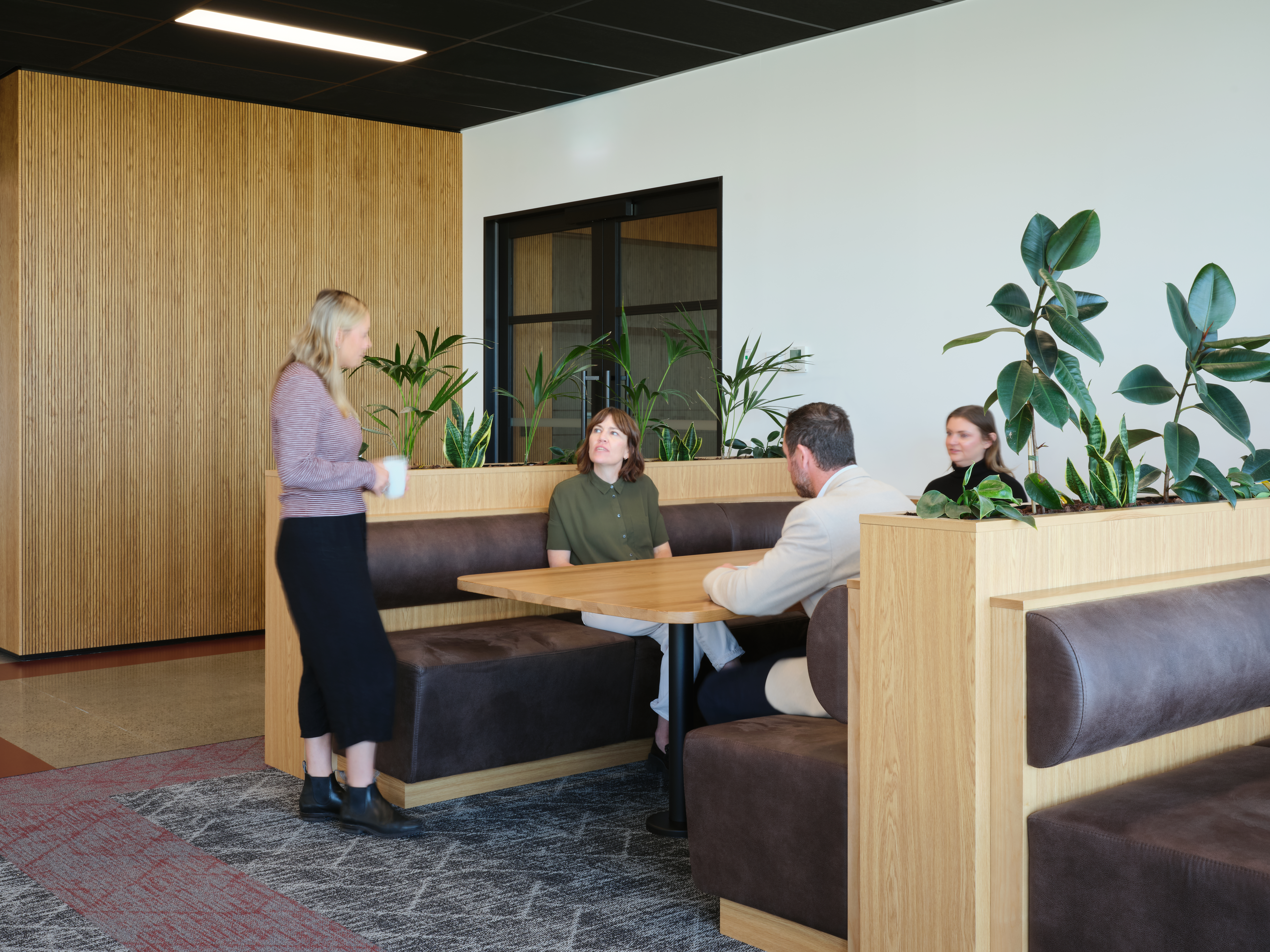 Breakout booth seating with employees collaborating
