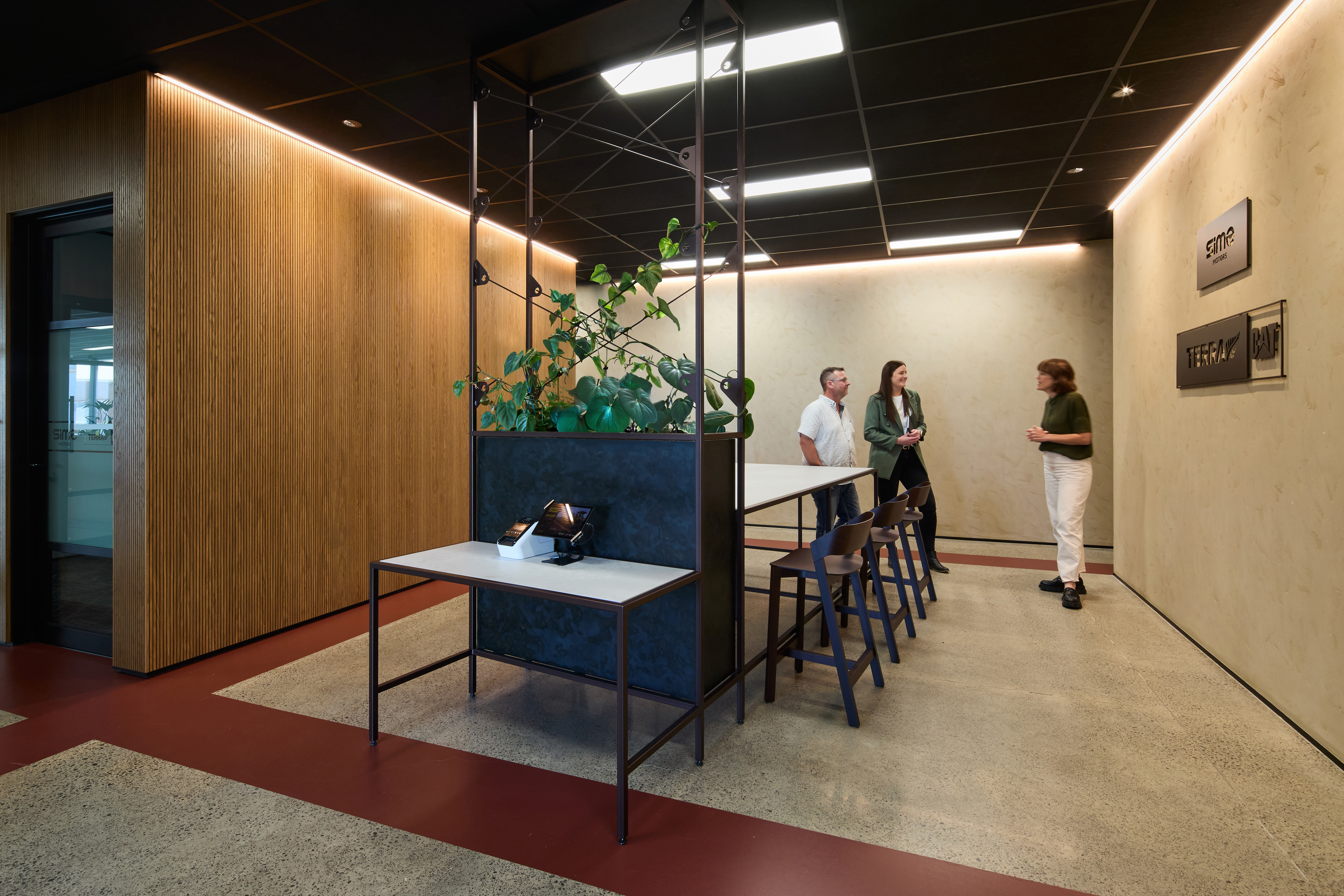 Welcome entrance with sign in table with employee greeting visitors