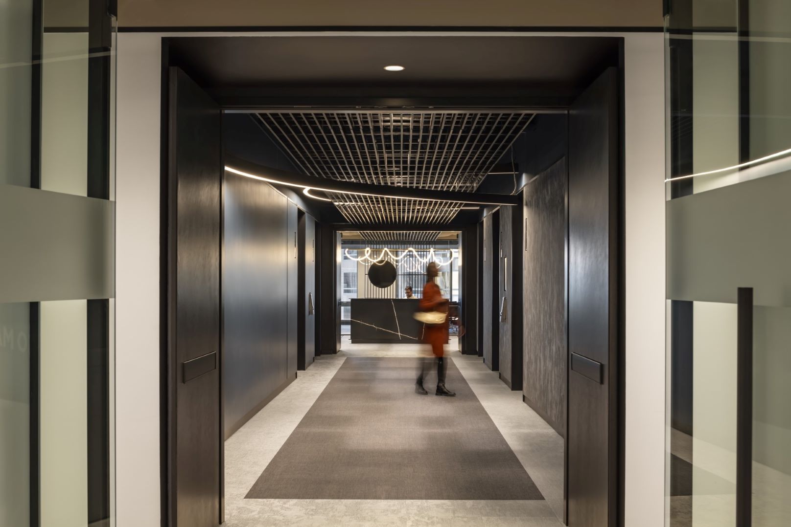 Orrick LA woman walking to elevator 